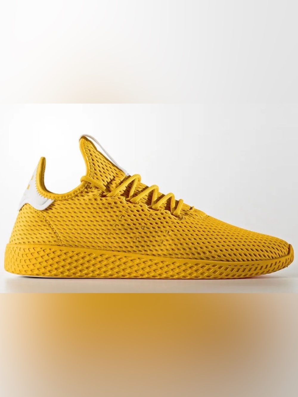 Pharrell x Adidas Men’s Tennis Hu in Solid Gold